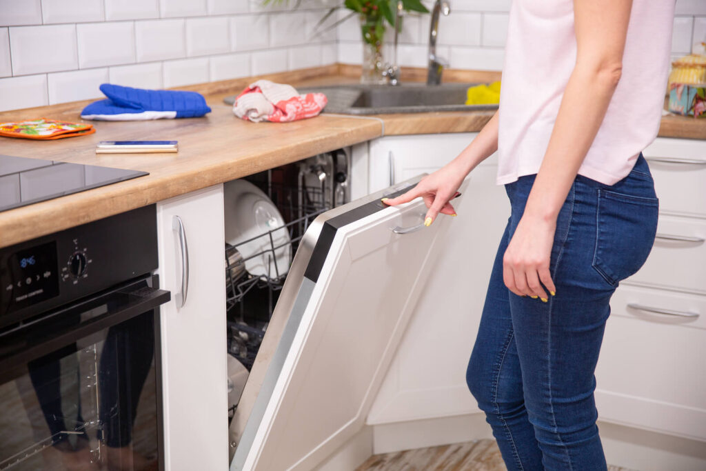 Clean-Dishes-In-The-Dishwasher-Run-woman-in-jeans