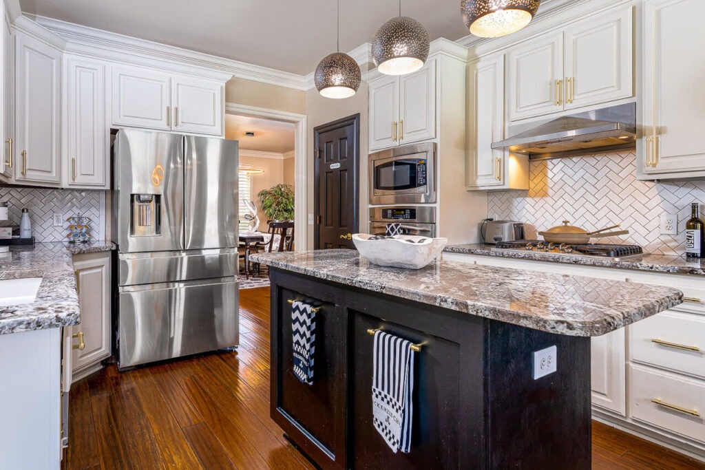 Sub-zero Freezer on a contemporary black gray and white kitchen