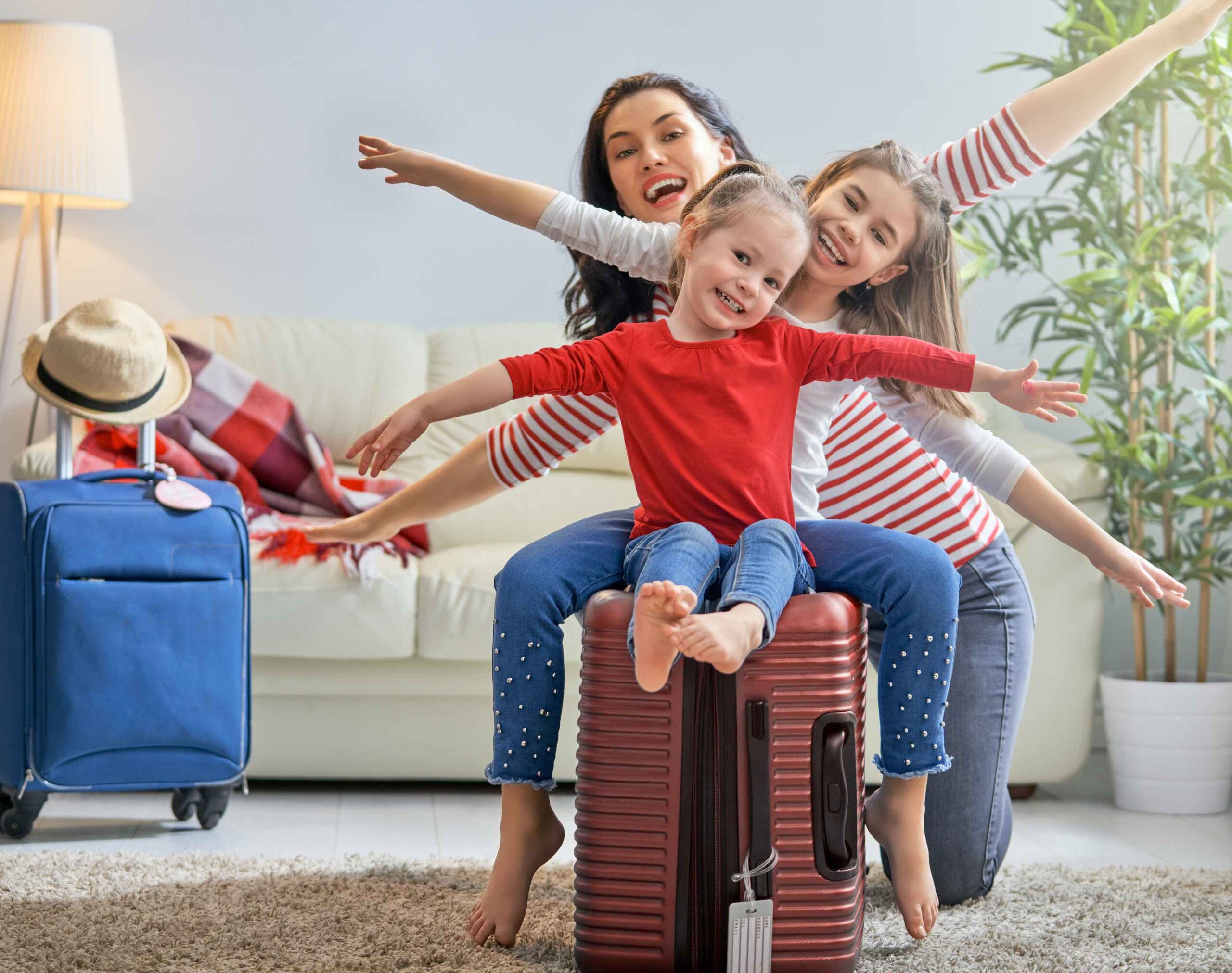 family-luggage-in-living-room-preparing-for-vacation-holidays