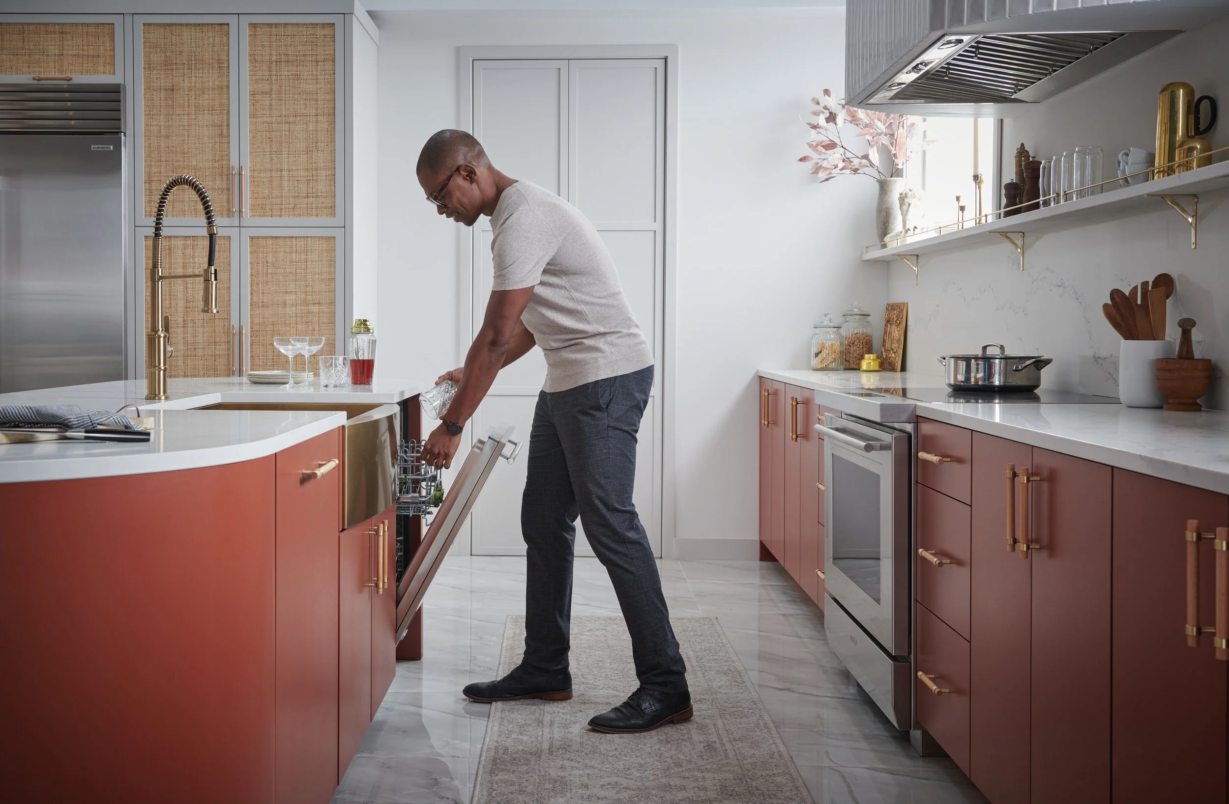 Man using his Cove dishwasher.
