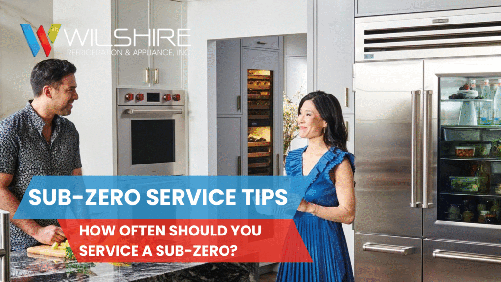Man and woman talking in a modern kitchen with a Sub-Zero refrigerator and wine storage unit, representing routine Sub-Zero service and maintenance.