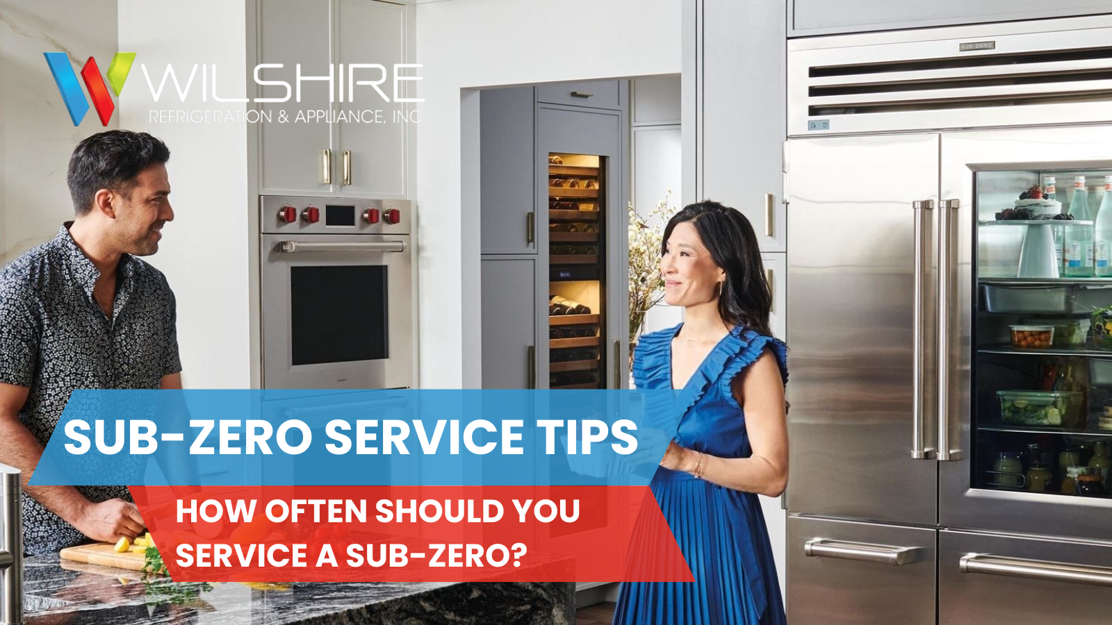 Man and woman talking in a modern kitchen with a Sub-Zero refrigerator and wine storage unit, representing routine Sub-Zero service and maintenance.