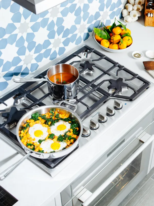 Thermador gas cooktops with food being cooked