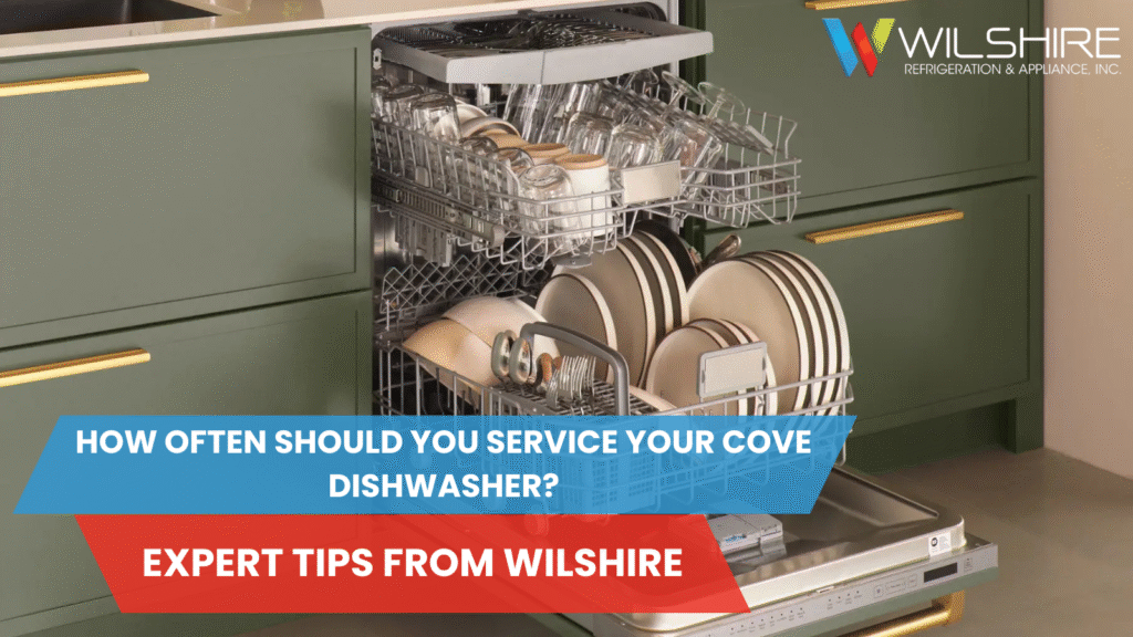 Open dishwasher with green kitchen drawers.