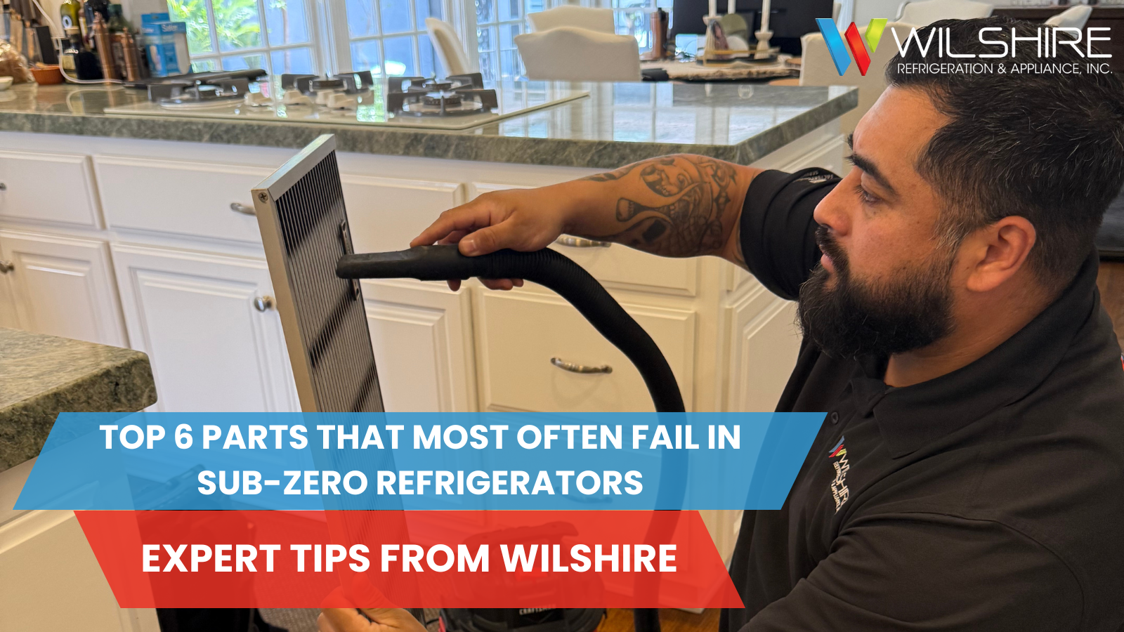 Wilshire technician vacuuming a refrigerator's filter.