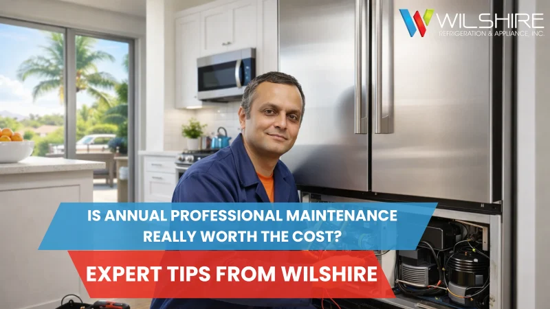 Factory-certified technician performing annual refrigerator maintenance in a modern Southern California kitchen.
