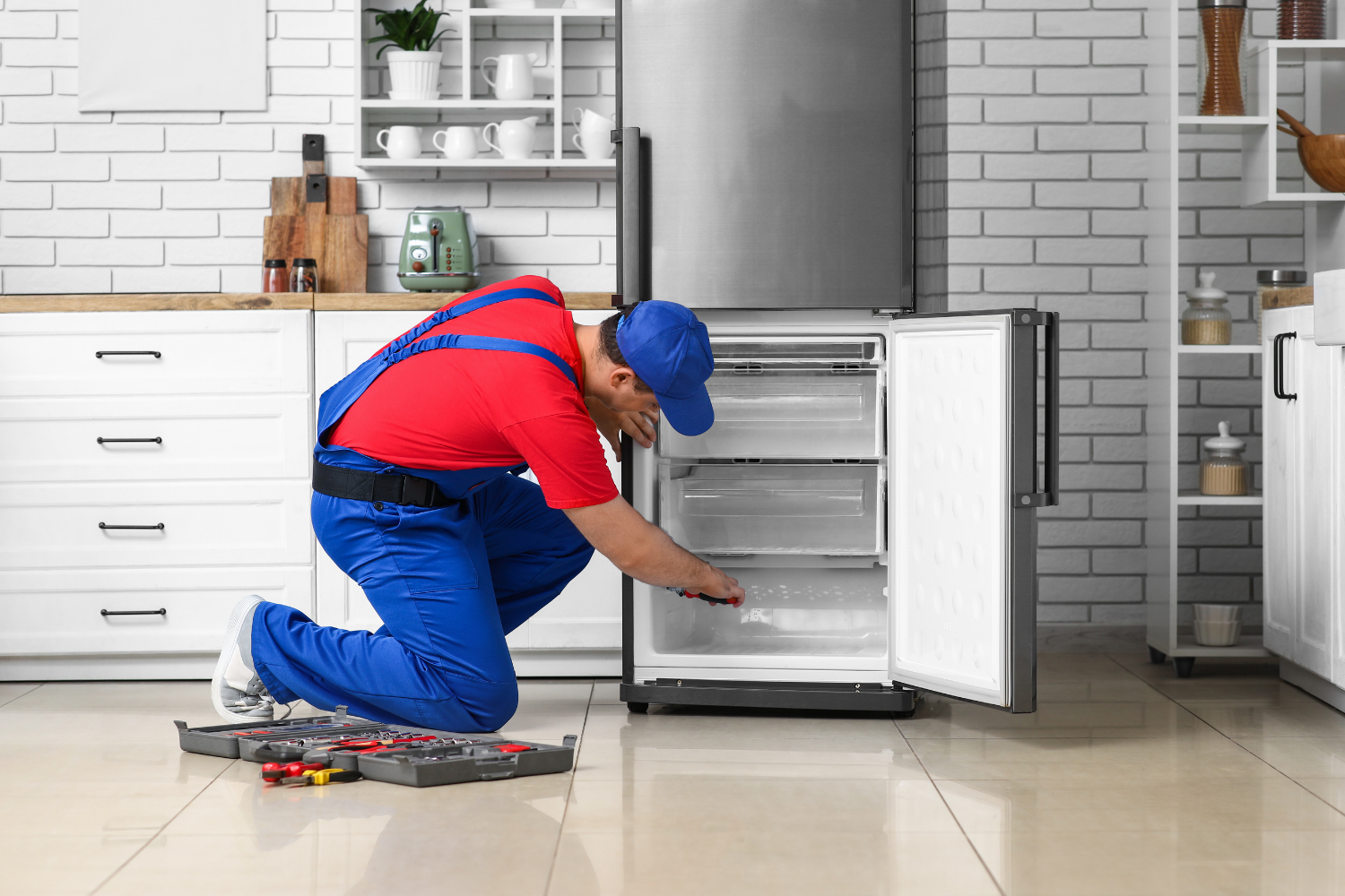 Factory-certified technician performing Sub-Zero and Viking wine cooler repair on built-in and under-counter wine fridges in a luxury kitchen.