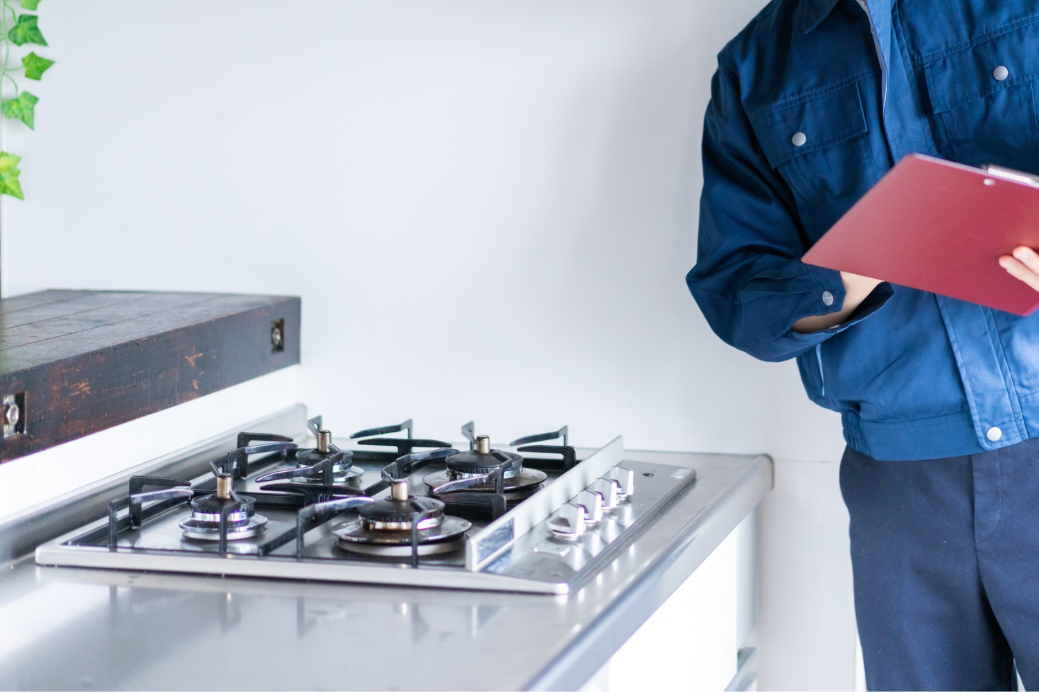 expert technician checking gas range