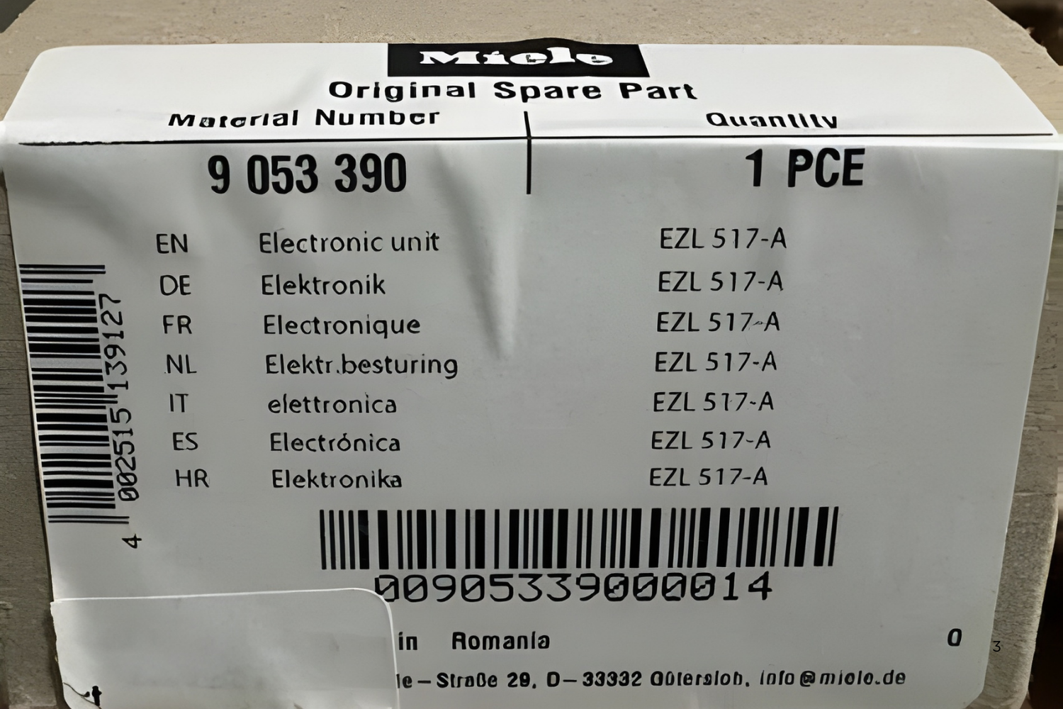 Miele original spare part label with material number 9 053 390 and quantity 1 PCE, listing "Electronic unit" and model EZL 517-A in multiple languages.