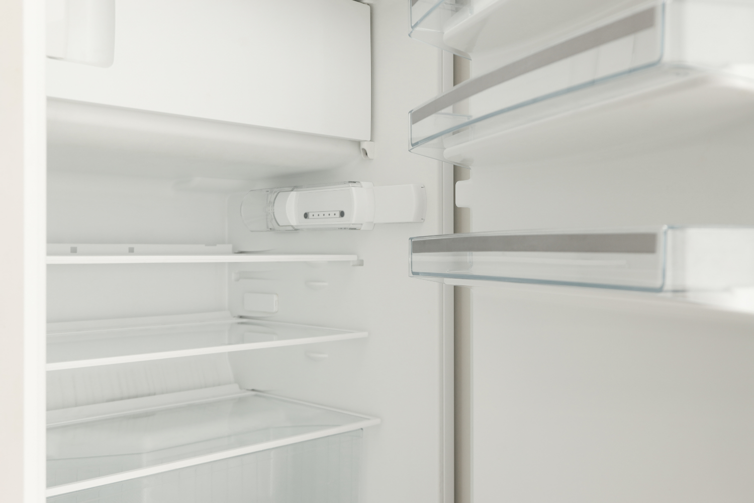 Empty refrigerator with clear shelves