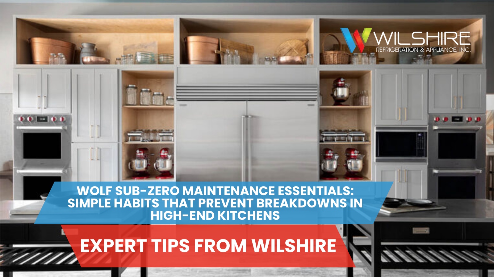 A modern kitchen featuring a large stainless steel refrigerator, double ovens, and two kitchen islands with black bases and metal tops.