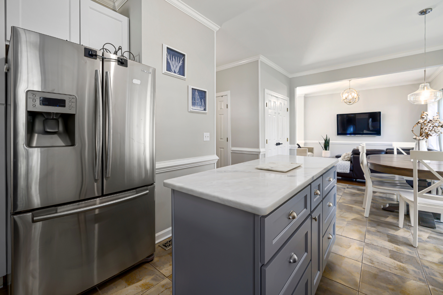 Built-in refrigerator vs freestanding comparison in sleek luxury kitchen with stainless steel fridge and glossy cabinetry