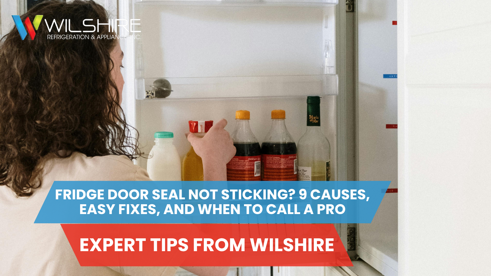 Person reaching into an open refrigerator door, illustrating common issues when fridge door seals stop sticking properly.
