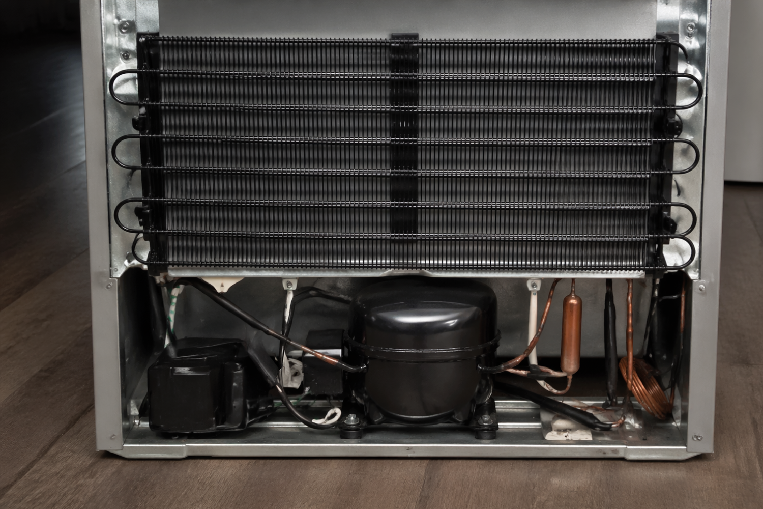 How to clean refrigerator coils with copper tubing and diagnostic tool during maintenance