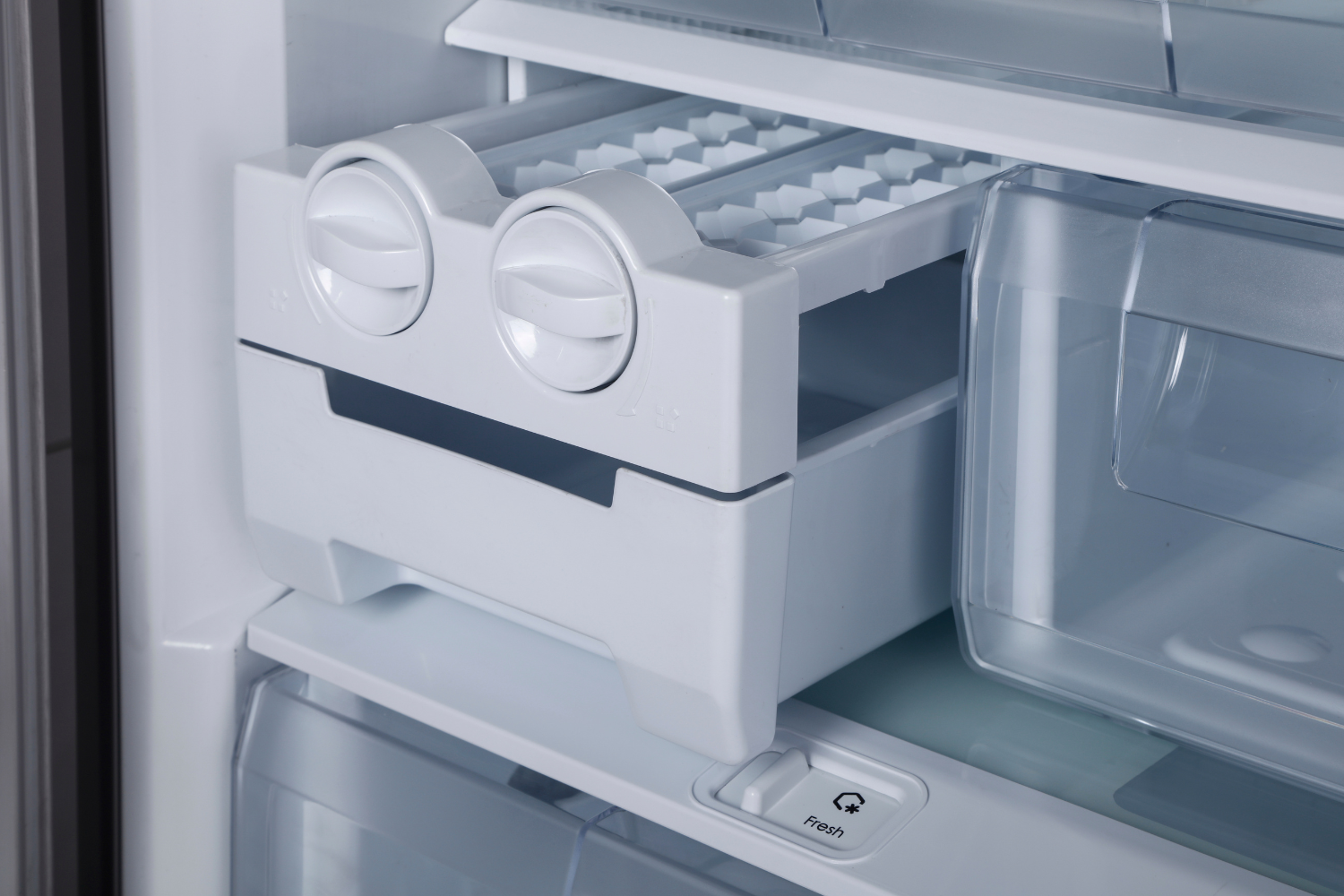 Sub-Zero ice maker tray inside a freezer for ice maker repair guide