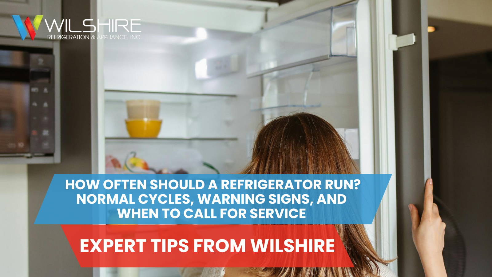 A person is reaching into an open refrigerator to place a container on a shelf.