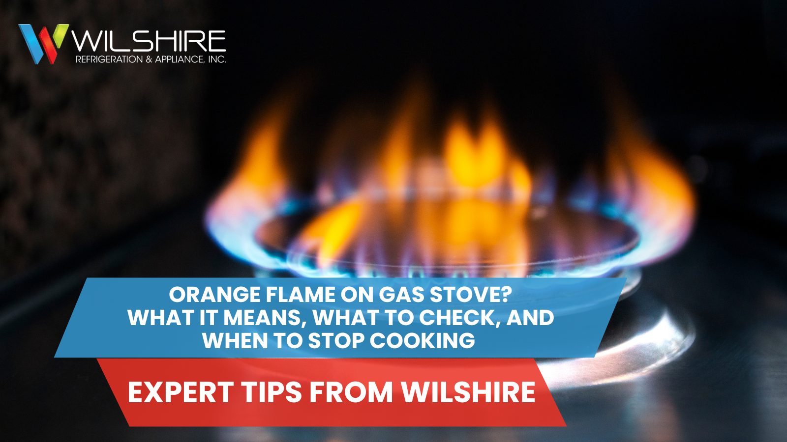 A close-up shot of a gas burner on a stovetop with blue and orange flames.