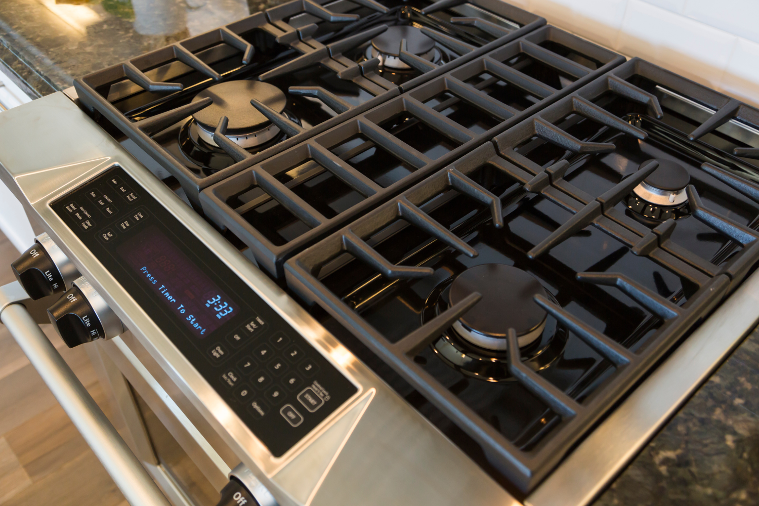 Luxury gas range with cooktop burners and control panel for stove repair service