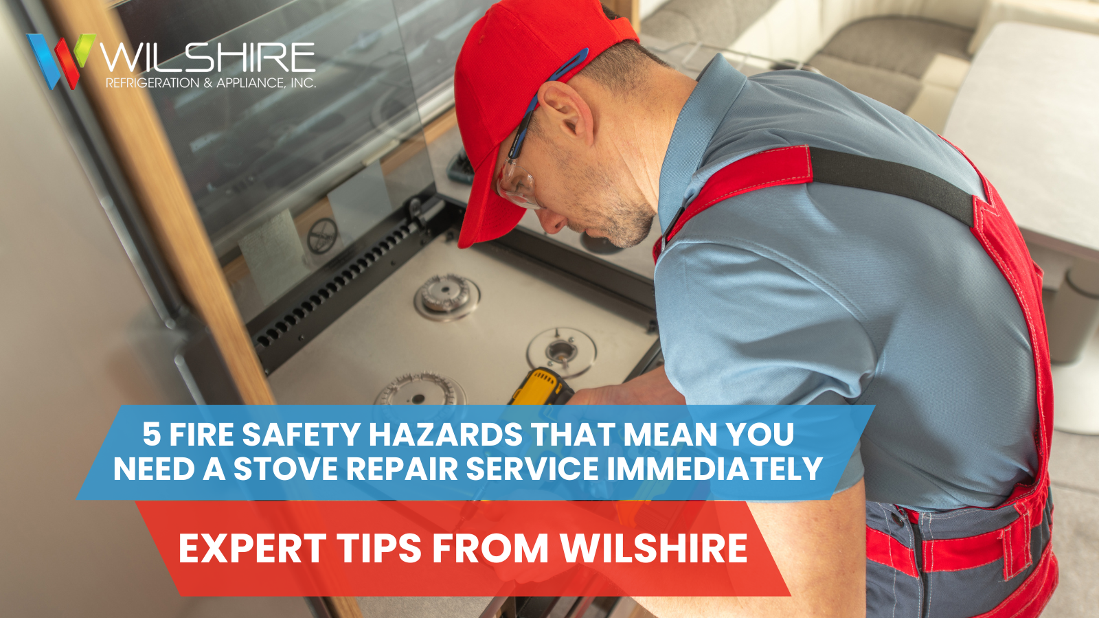 A person in a red cap and overalls uses a cordless drill to work on a stove inside a recreational vehicle.
