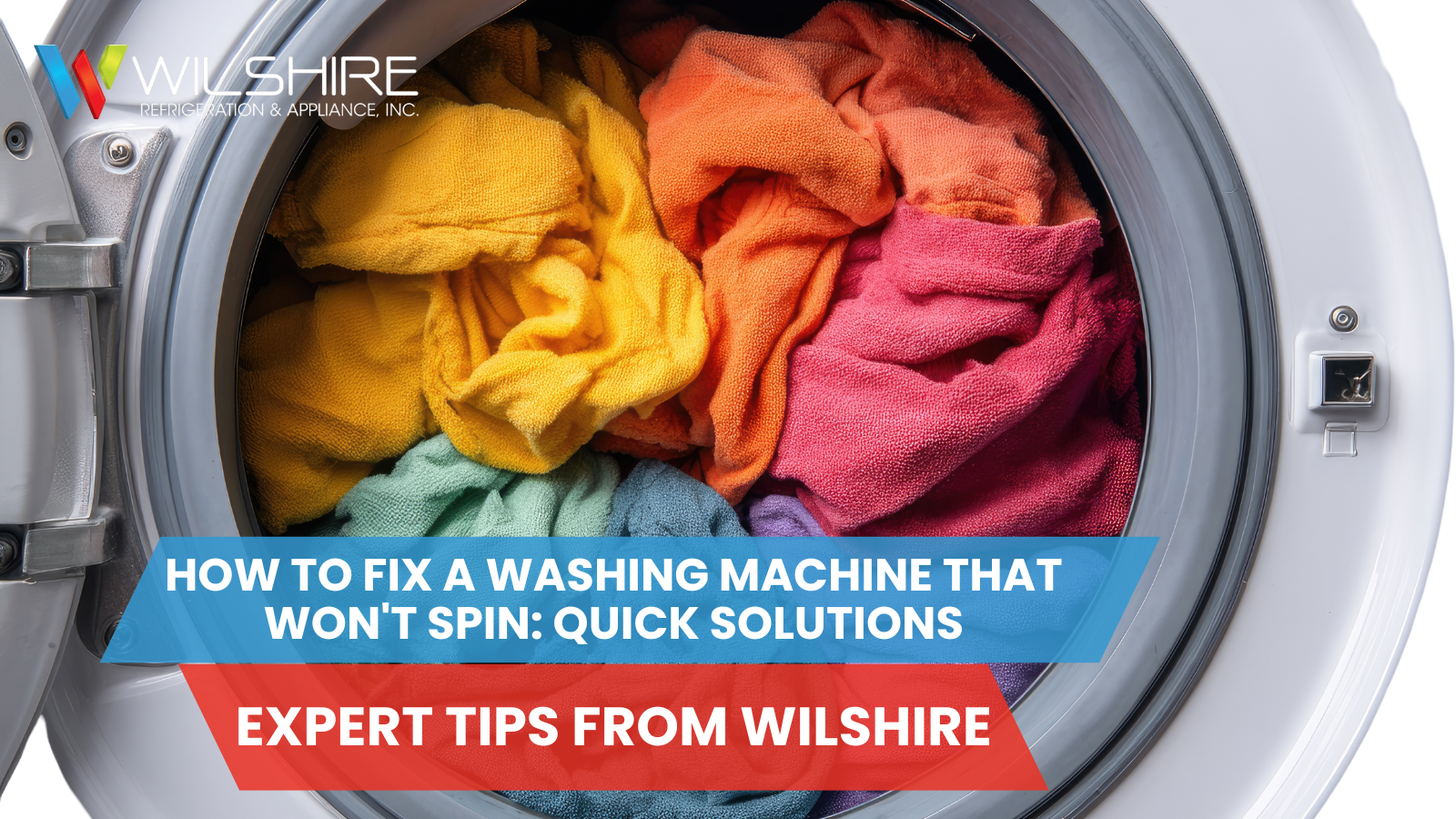 A washing machine drum filled with colorful towels, including yellow, orange, red, purple, blue, and green.