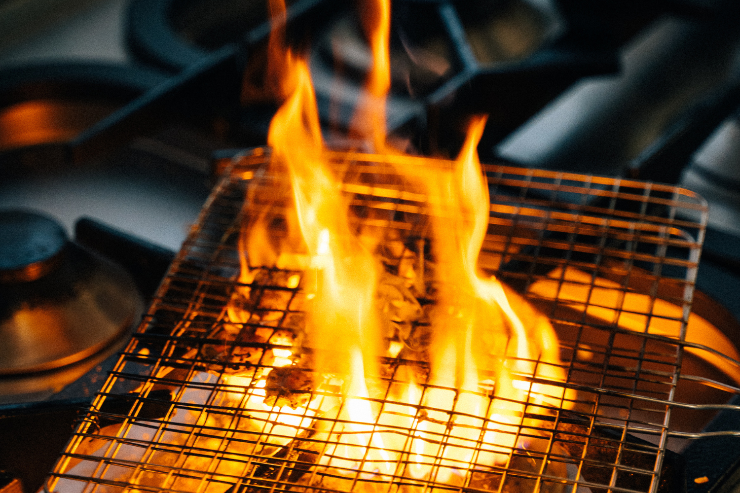 Large orange flame on gas stove burner showing when an orange flame on a gas stove may be dangerous.