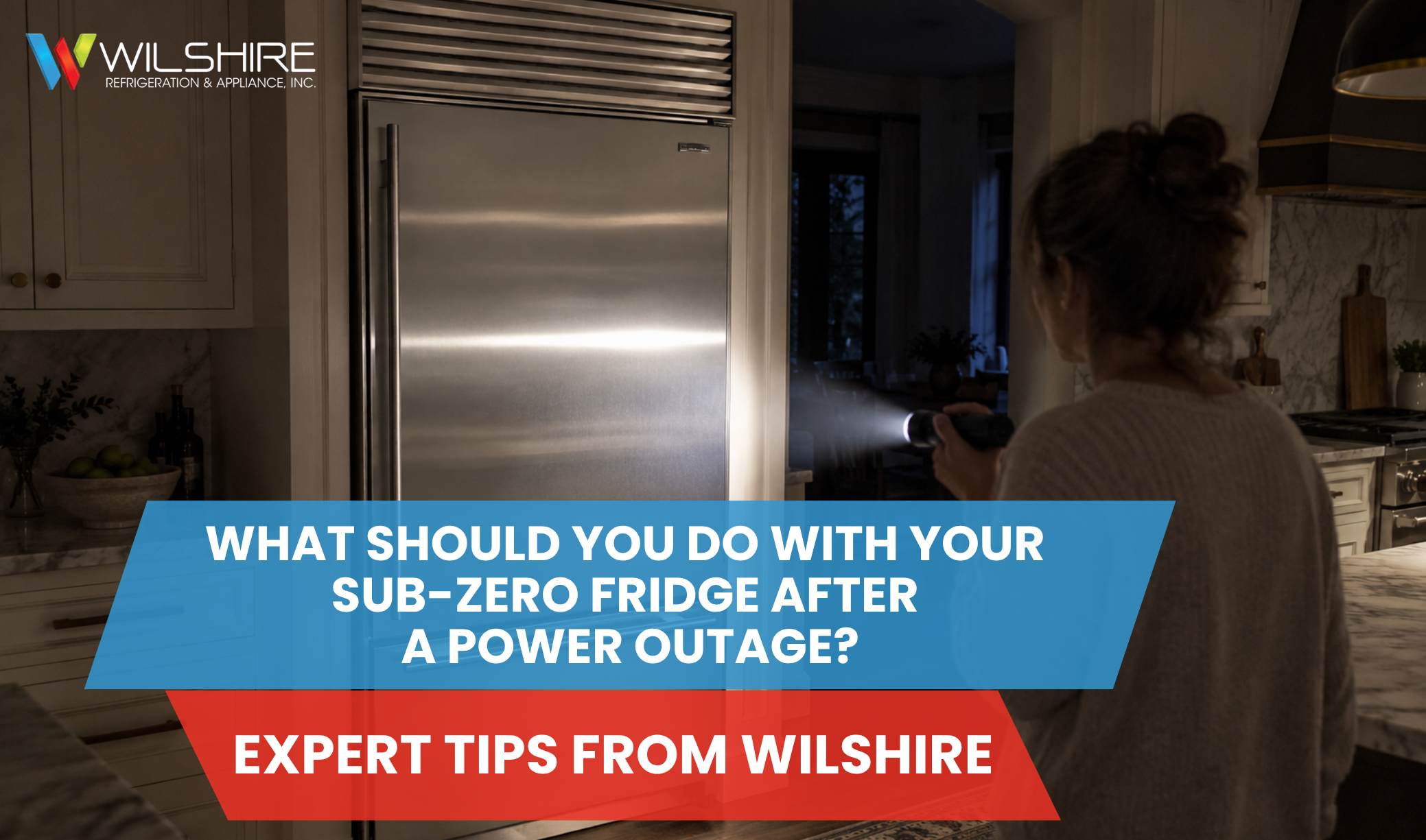 Stainless steel Sub‑Zero refrigerator in a dim kitchen with a flashlight pointed at it, representing expert advice on handling Sub‑Zero fridges after a power outage.