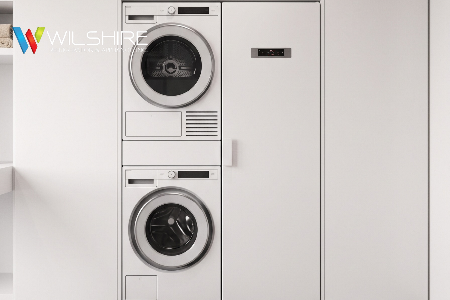 tacked front‑loading ASKO washer and dryer in modern laundry room