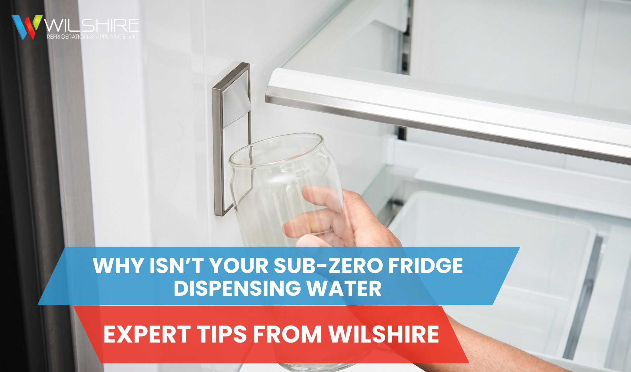 Hand holding glass under refrigerator water dispenser